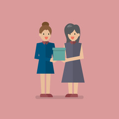 Woman giving a gift box to another