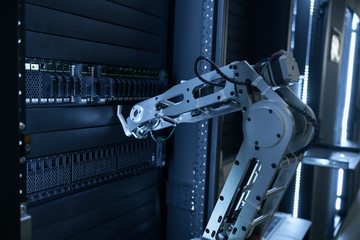 Robot arm is manually operating data center hardware