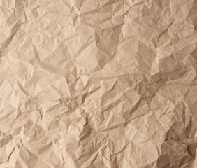 crumpled blank sheet of brown wrapping kraft paper