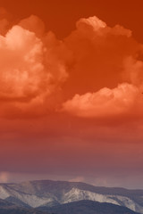 clouds above mountains, colorful sunset landscape
