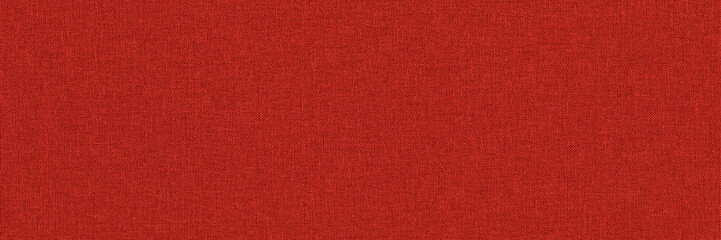 Close-up long and wide texture of natural red fabric or cloth in light red color. Fabric texture of natural cotton or linen textile material. Red canvas background.