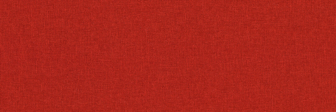 Close-up long and wide texture of natural red fabric or cloth in light red color. Fabric texture of natural cotton or linen textile material. Red canvas background.