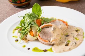 Fried meat served with sauteed vegetables
