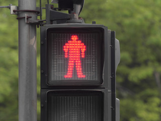 close up of red pedestrian traffic light in Shanghai city.
