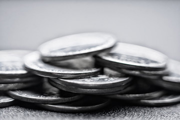 Metal coins stacked on white background, currency exchange and wealth economic business investment news background, growing up fund investment