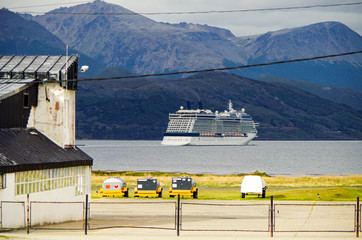 Modern cruiseship or cruise ship liner Celebrity Eclipse sails away from port of Ushuaia in...