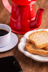 toast and a cup of coffee on wooden table