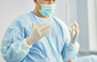 Fototapeta premium Several doctors surrounding patient on operation table during their work. Team surgeons at work in operating room