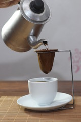 

strained coffee in filter cloth