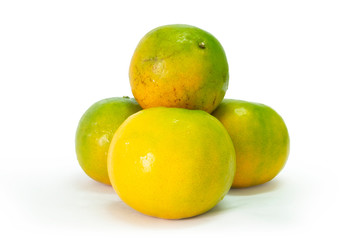 Fresh green tangerine on white background. selective focus, soft focus.