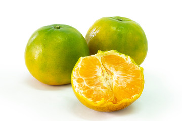 Fresh green tangerine on white background. selective focus, soft focus.