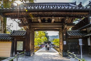 Old wooden gate to palace square and sunset in Nikko, Japan