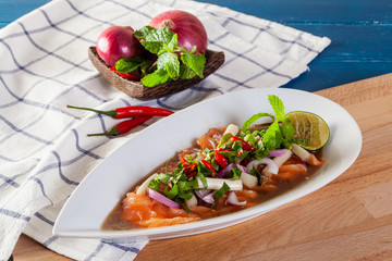 Spicy salad of fresh salmon with Thai vegetables