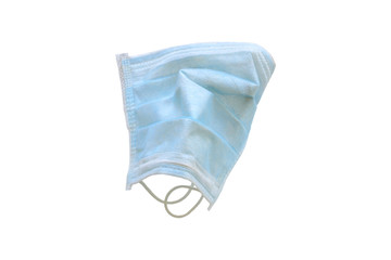 Used blue medical surgical mask, Medical protective mask on white background. Disposable surgical face mask cover the mouth and nose. Selective focus.