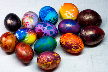Fototapeta na wymiar Painted in different colors Easter eggs on a white background