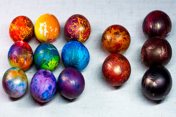 Fototapeta na wymiar Painted in different colors Easter eggs on a white background