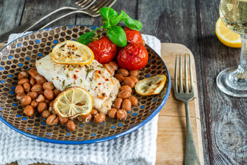 Halibut baked in white wine with borlotti beans and tomatoes