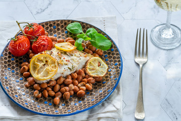 Halibut baked in white wine with borlotti beans and tomatoes