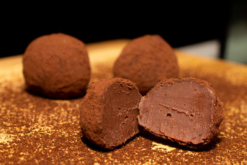 Dark Chocolate truffles on wood background