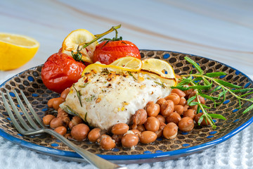 Halibut baked in white wine with borlotti beans and tomatoes
