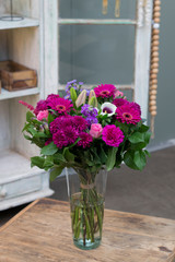 Flower bouquet in a vase in interior