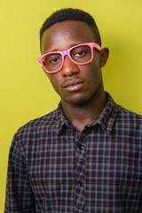 Face of young African hipster man with eyeglasses