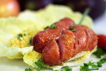 grilled pork sausage with vegetable salad, selecitive focus
