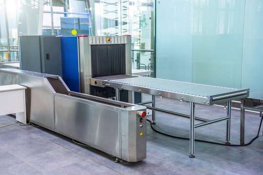 X-ray machine for screening passenger luggage at the airport check-in counter.