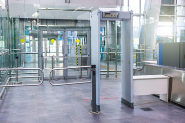 Security checks the metal detector installed at the entrance to a building public place.