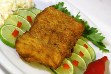healthy food, breaded and grilled fish file, selective focus