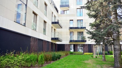 Fototapeta na wymiar Modern and new apartment building. Multistoried, modern, new and stylish living block of flats.