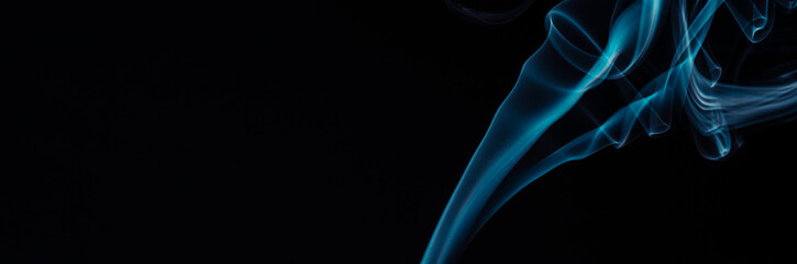 Blue smoke on black background