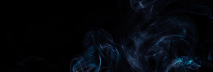 Blue smoke on black background