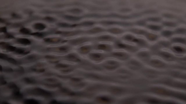 Waves Subwoofer Audio Speaker Vibrations and Black Water Liquid