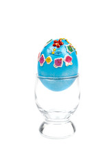 colorful eggs in glass on white