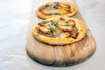 Delicious Mexican quesallidas made with chicken, tomato pieces and served with guacamole sauce.