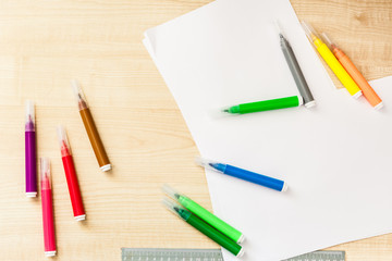 Felt-tip pens, pencils in boxes, different colors, the order on the table, the work of the child, home creation and order, the joy of drawing, school desk and quarantine