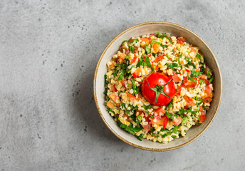 Tabouli or tabbouleh salad with bulgur, tomatoes, lime, mint, parsley