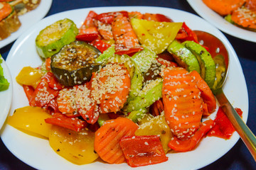 Grilled vegetables on a plate with sauce