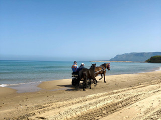 Two-man horse cart on the beach in Balestrate, Sicily