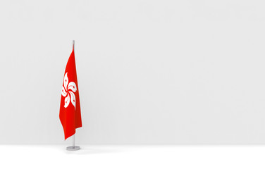 Obraz premium 3d rendering. folding Hong Kong National flag pole podium on empty gray cement wall stage background.