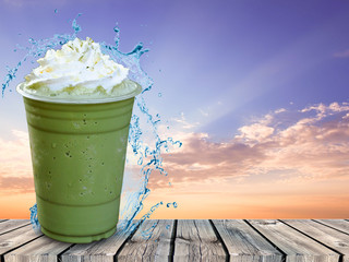 Smoothie green tea blended in a glass of water spreading murmur