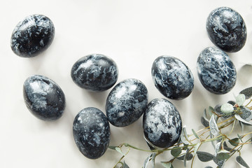 Easter black eggs with some plant