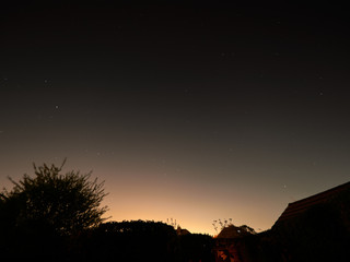 Stars sparkle clearly on a cloudless night over the back garden in Wakefield, Yorkshire.