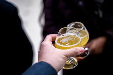 People toasting with beer