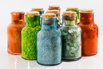 glass bottles with sand from exotic beaches 