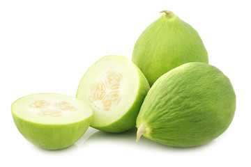 Two cumelo's (mix between a cucumber and a melon) and a cut one on a white background