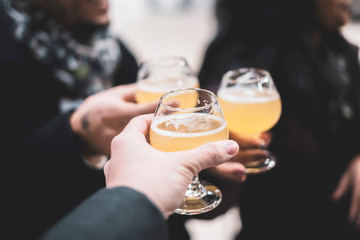 People toasting with beer