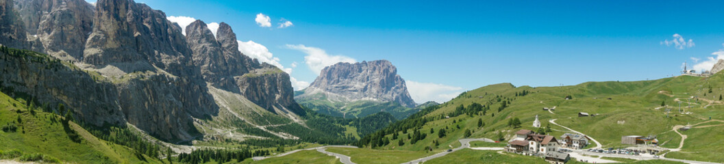 Fototapeta na wymiar Panoramic view of valley of Passo Gardena toward Selva Wolfenstein, Dolomites, South Tyrol, Italy, Europe