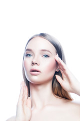 Fototapeta premium Beautiful model girl face apply facial treatment with hands. Healthy skin, natural make-up. White background